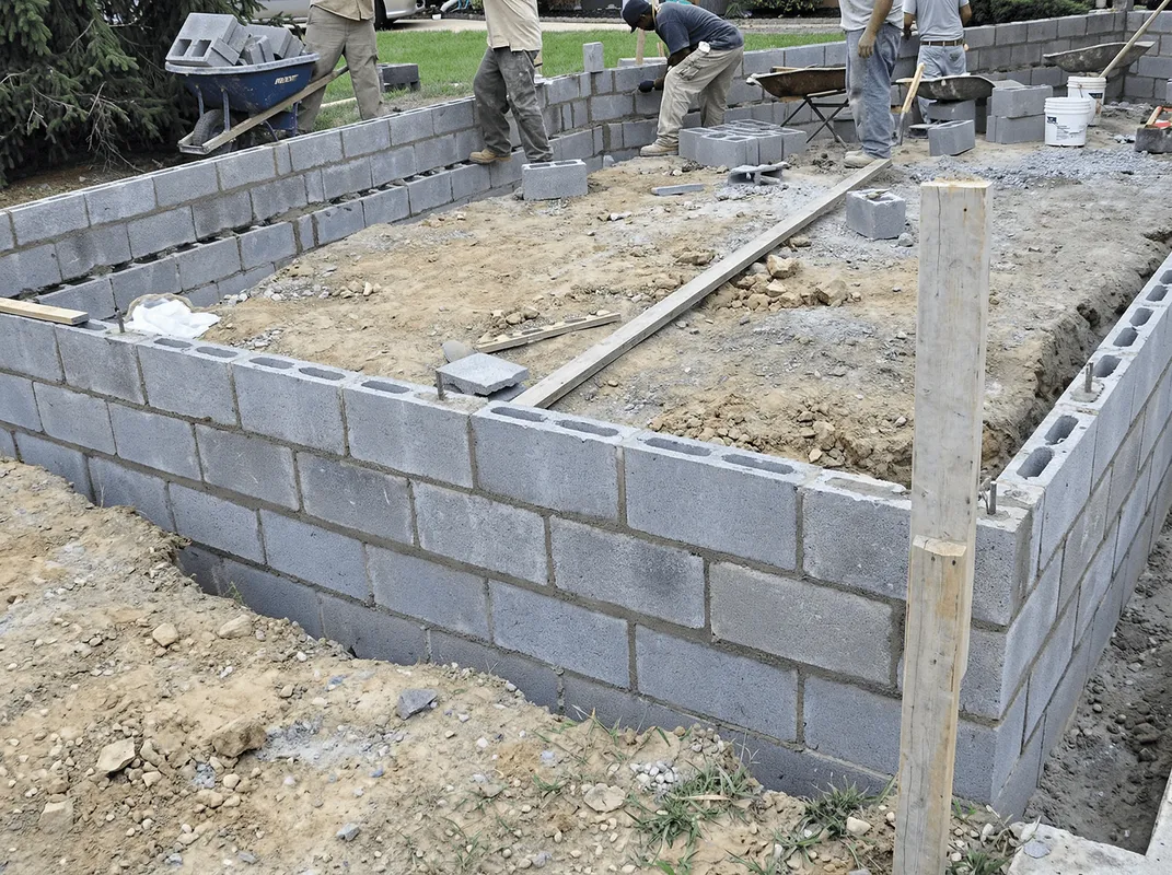 Professionals building a foundation with blocks in Little Rock, AR